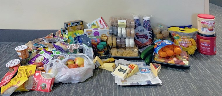 Photo of a week's worth of food. Items shown are doughnuts, summer sausage, cheese, and crackers. 