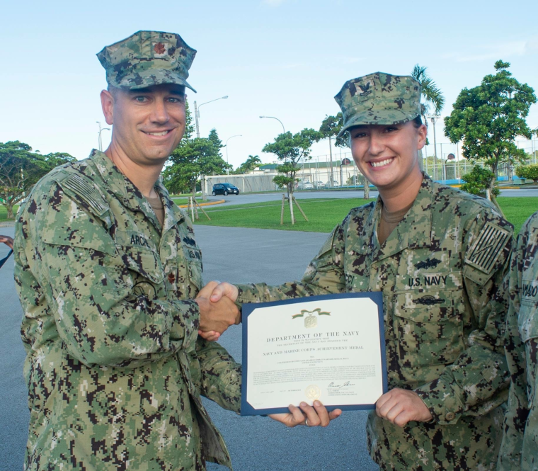 Kelli receiving a Navy and Marine Corps Achievement Medal from her Commanding Officer in Okinawa, Japan