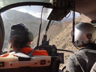 Eyeballing a landing location during rare plant surveys on the edge of the Roan Plateau in western Colorado